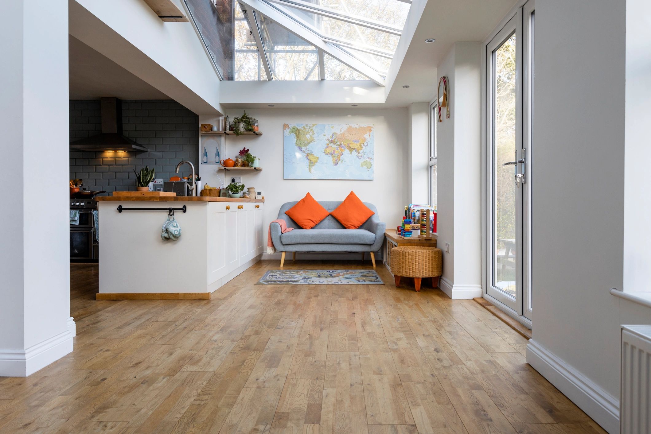 Modern open-plan living space with wood-look flooring
