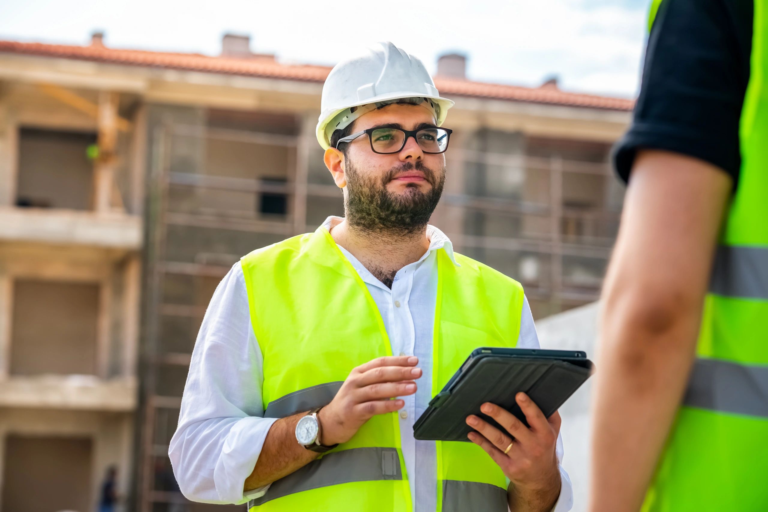 Construction professionals reviewing a project plan on site
