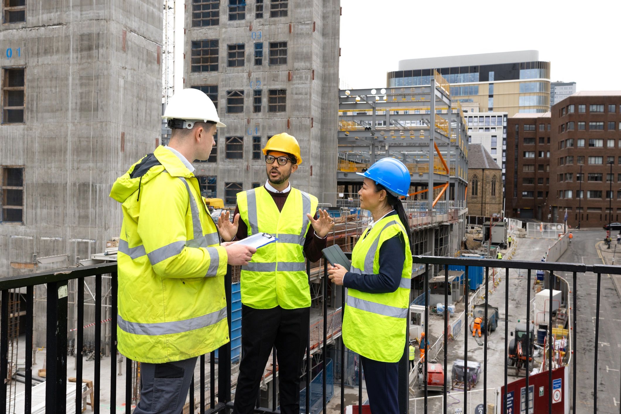 Service Demand Group team reviewing a roof inspection plan on site